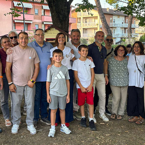 Group of adult and child volunteers together outdoors