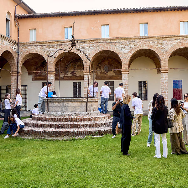 Volunteers gathered in historic courtyard