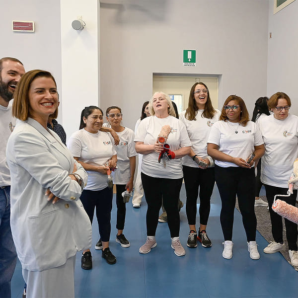 Volunteers with painting tools