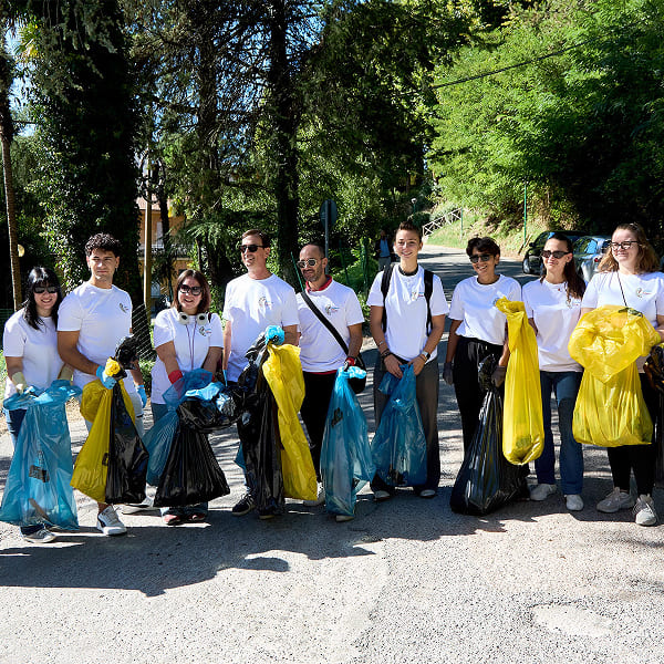Volunteers holding trash bags