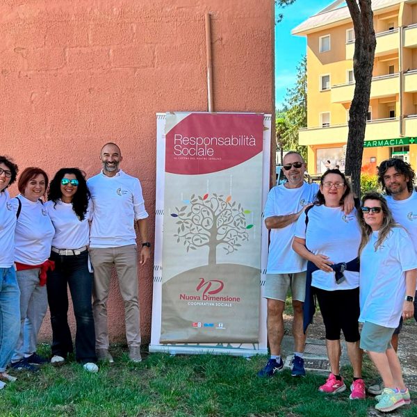 Volunteers next to a banner about social responsibility