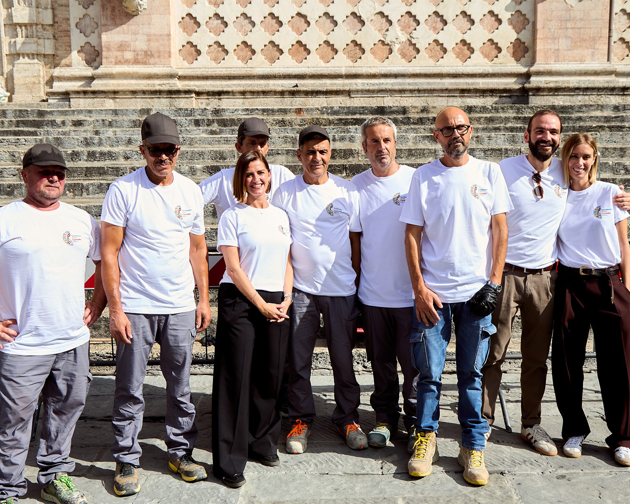 Group of volunteers in front of a historic building