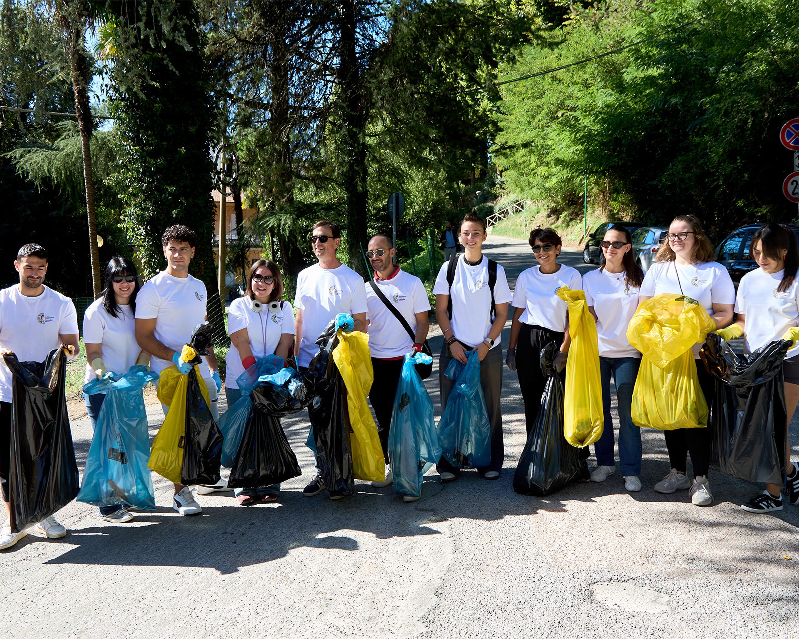 Volunteers holding trash bags
